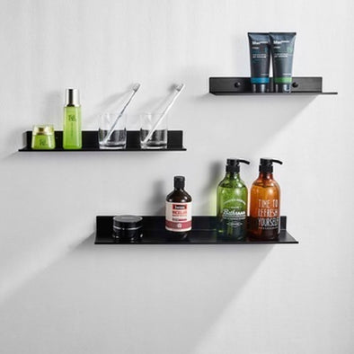 Black Non-Perforated Shelf on Bathroom Wall – "Sleek black bathroom shelf mounted without drilling"
